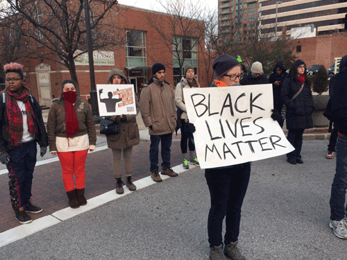 A moment of silence at the clergy-led action in Clayton, near Ferguson