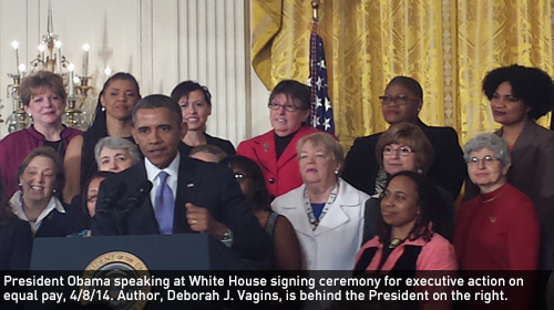 President Obama speaking at White House signing ceremony for executive action on equal pay, 4/8/14. Author, Deborah J. Vagins, is behind the President on the right.